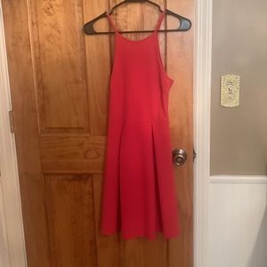 This dress from Soprano is a size small in a coral color.